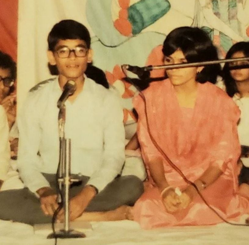 Vandana and her brother while singing a bhajan on a Janmashtami festival during their younger days