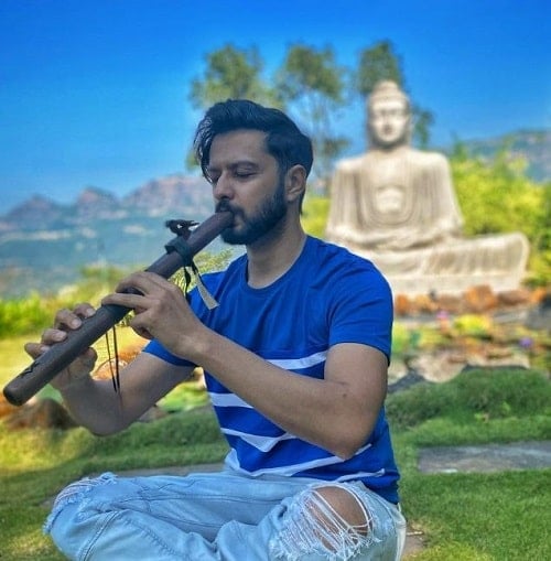 Vatsal Sheth playing a flute