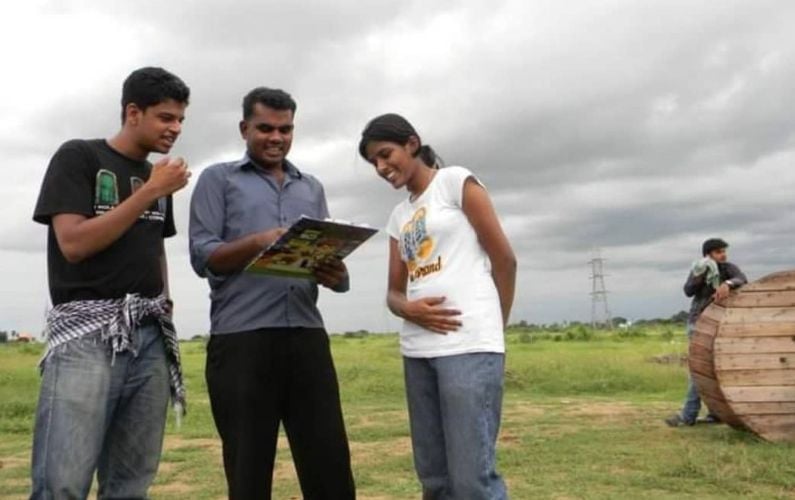 Vatsan Chakravarthy (left) with crew members while working as an assistant director