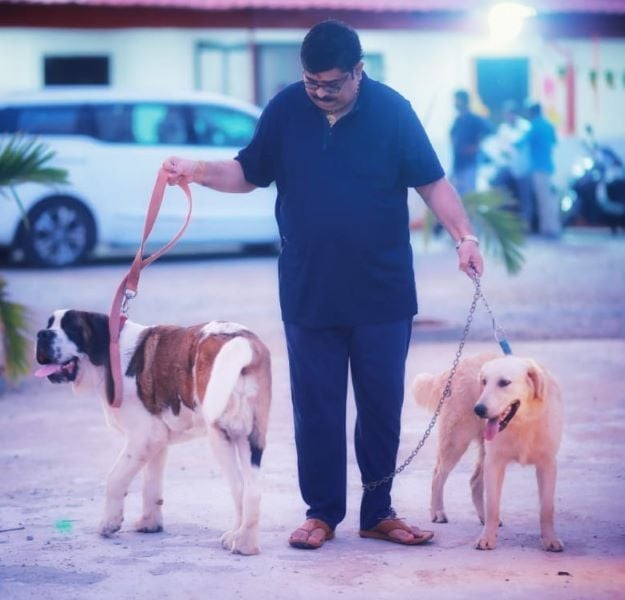 Venu Swamy with his pet dogs