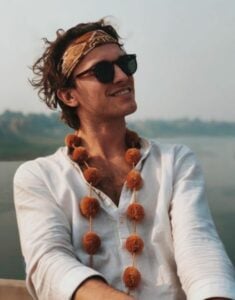 Victorien Mulliez wearing a pom pom garland