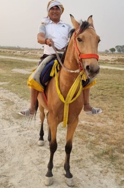 Vijay Lal Yadav riding a horse