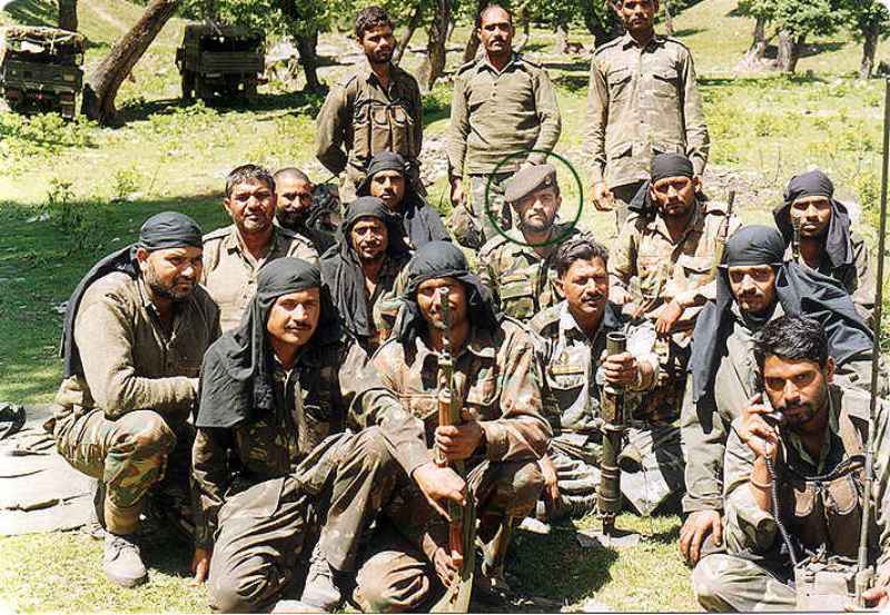 Vijayant Thapar posing for a photo with the Alpha Company men in Kargil