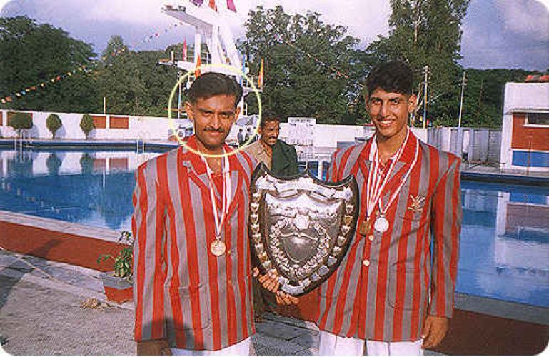 Vijayant with the swimming trophy that he won at IMA