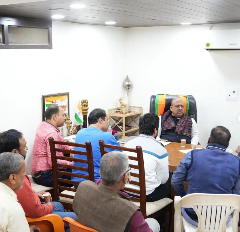 Vijender Gupta sitting in his office