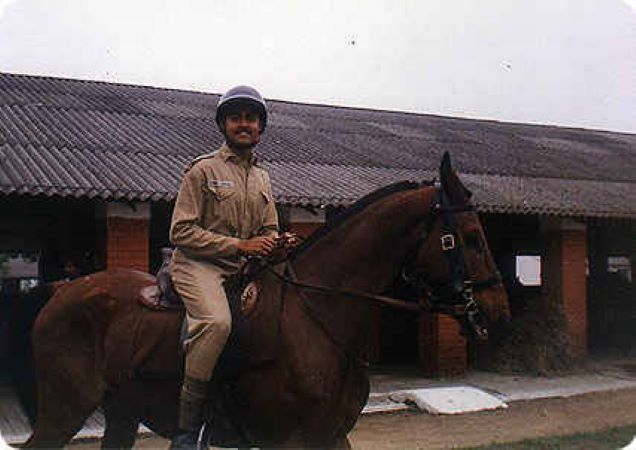 Vijayant sitting on a horse while he was at IMA