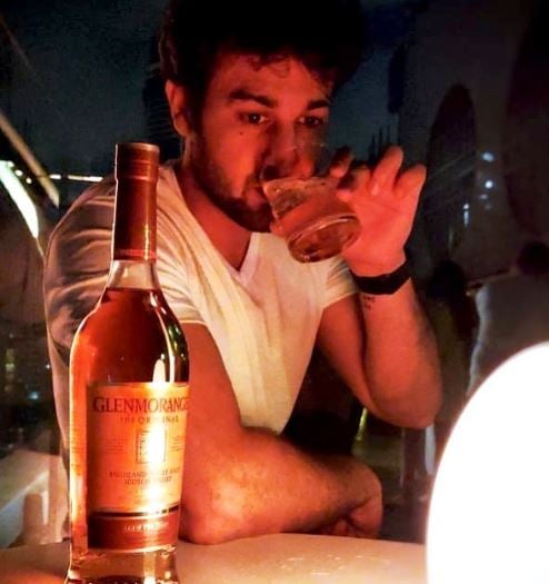 Vikram Bakshi consuming Whiskey