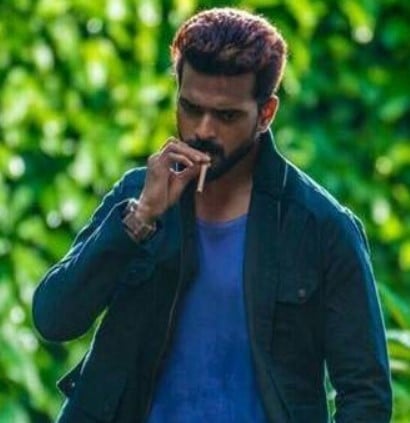 Vikranth Santosh while smoking a cigarette