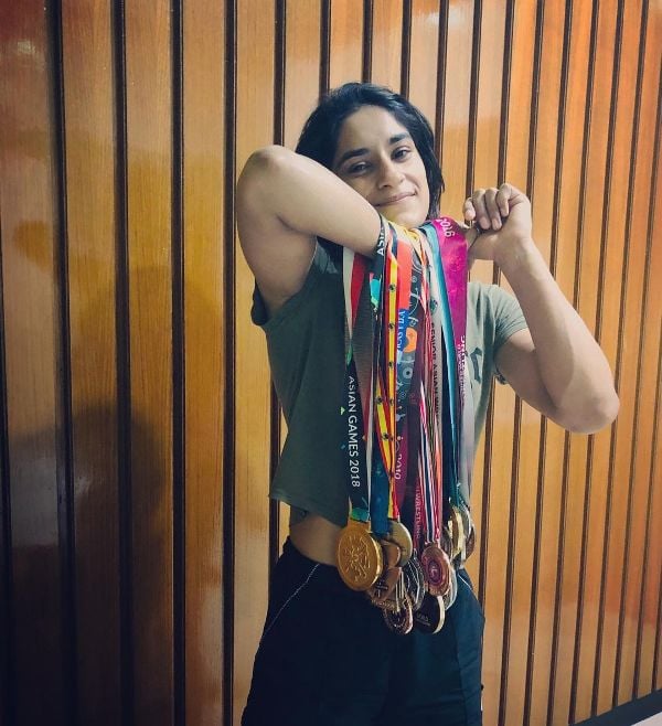 Vinesh Phogat posing with her medals
