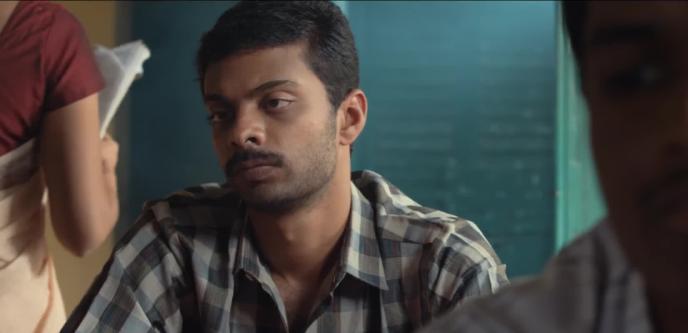 Vinoth Kishan as Selvam in a still from the Tamil film Andhaghaaram (2020)