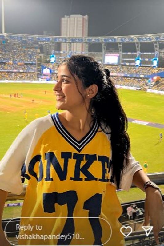 Vishakha Pandey posing at a cricket stadium