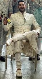 Vishal holding a bottle of beer