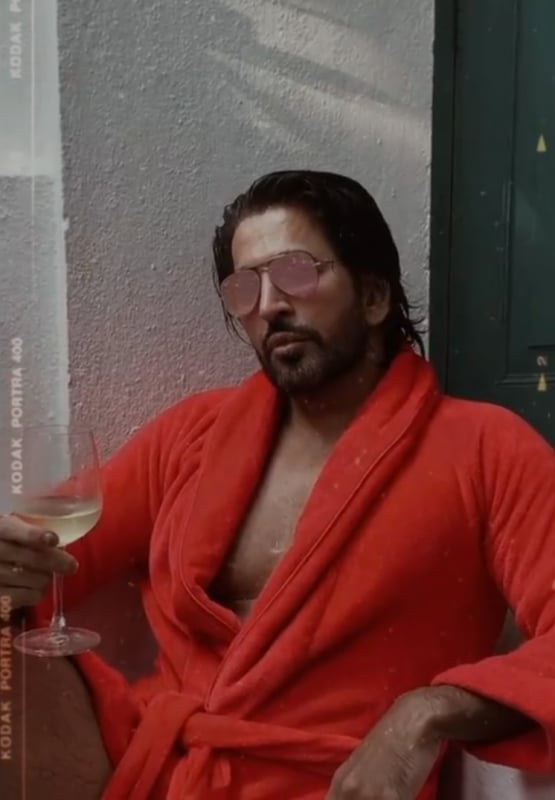 Vishal holding a glass of wine