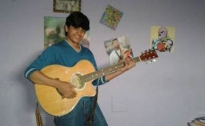 Vishesh Bansal playing the guitar