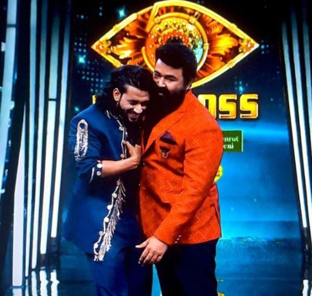 Vishnu Joshi with the host Mohanlal in a still from the show Bigg Boss Malayalam - Season 5 (2023)