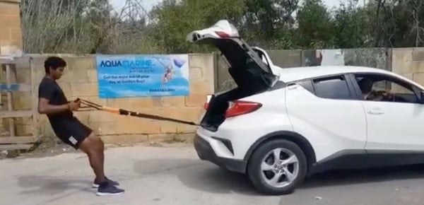 Vishnu Saravanan pulling a car during his practice session for the 2021 Tokyo Olympics