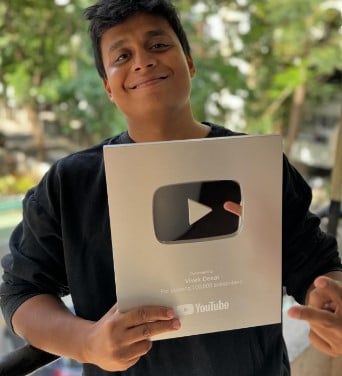 Vivek Desai posing with his Silver YouTube Play button