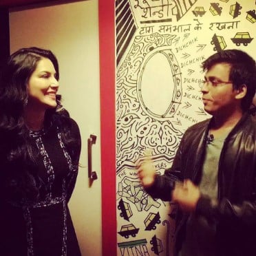 Vivek Desai while performing a magic trick with Sunny Leone