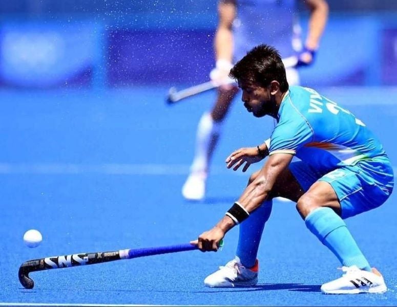 Vivek Sagar Prasad trying to take control of the ball at the Summer Olympics