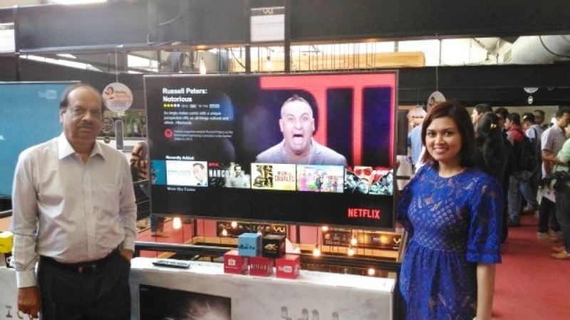 Vu Technologies CEO Devita Saraf posing with father