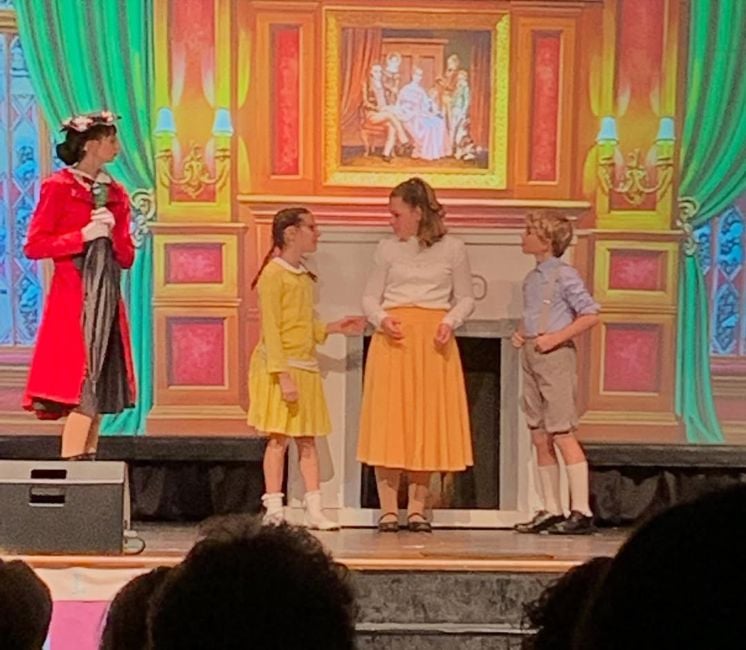 Walker Scobell (right) in a still from the school play, Mary Poppins