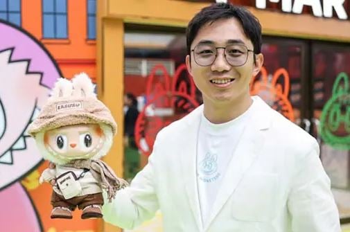 Wang Ning with Labubu doll