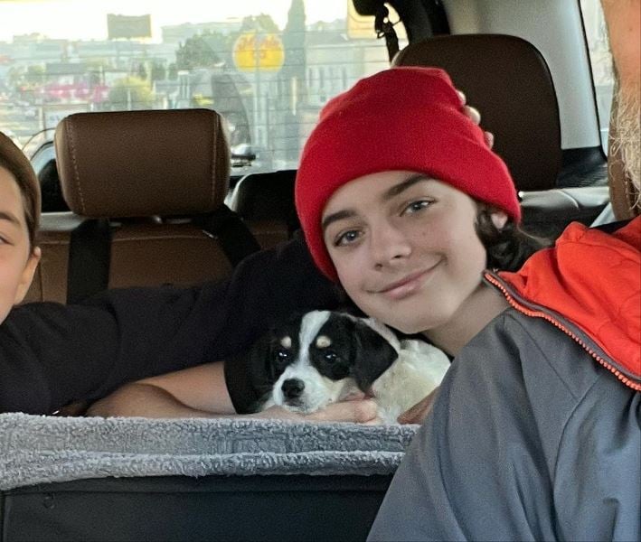 Wesley Kimmel posing with his pet dog