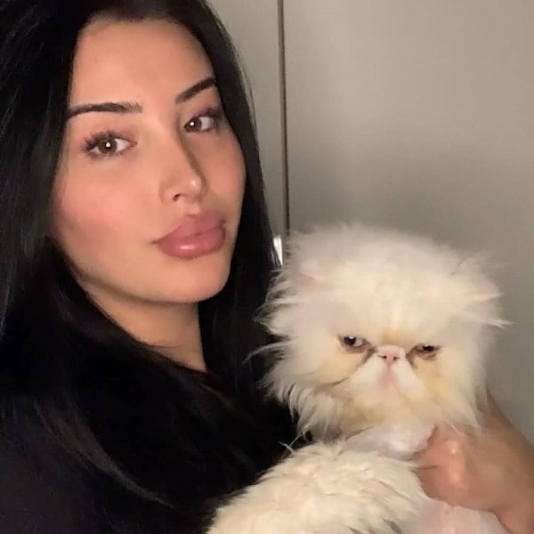 Wizard Liz posing with her cat