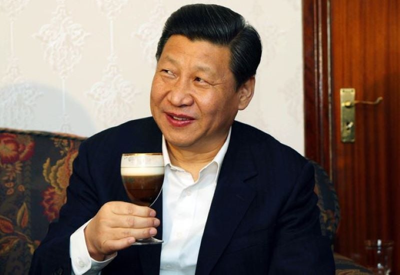 Xi Jinping holding a glass of liquor