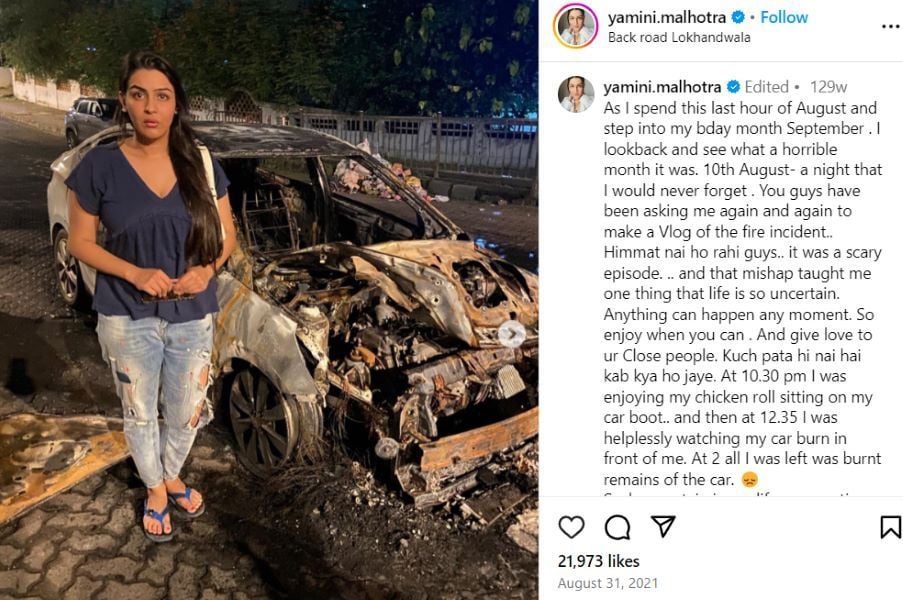 Yamini Malhotra standing with her burnt car