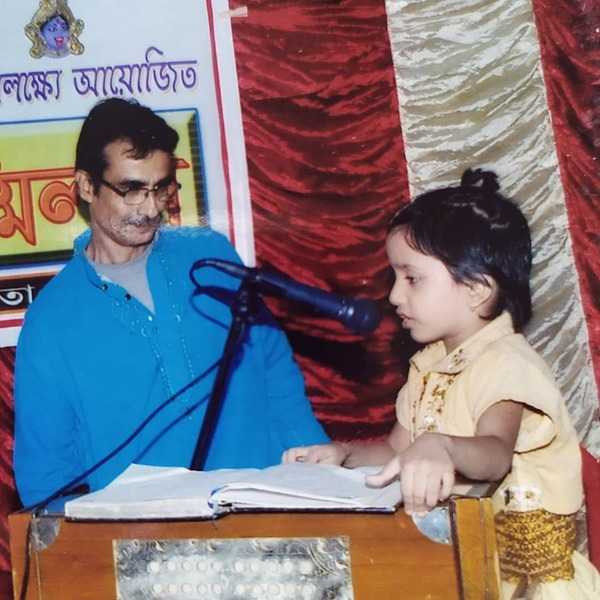 Young Bidipta Chakraborty at a singing competition with her Father