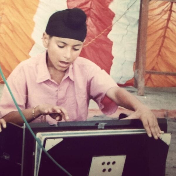 Young Navjeet playing harmonium