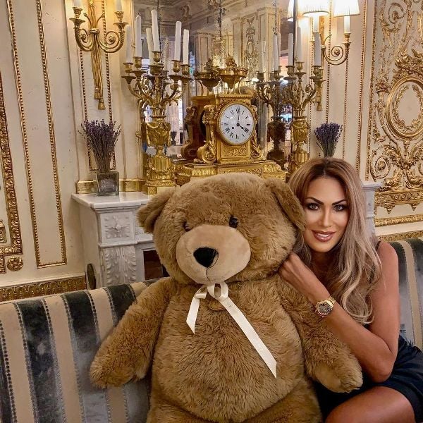 Yvonne Tihina while posing with a teddy bear