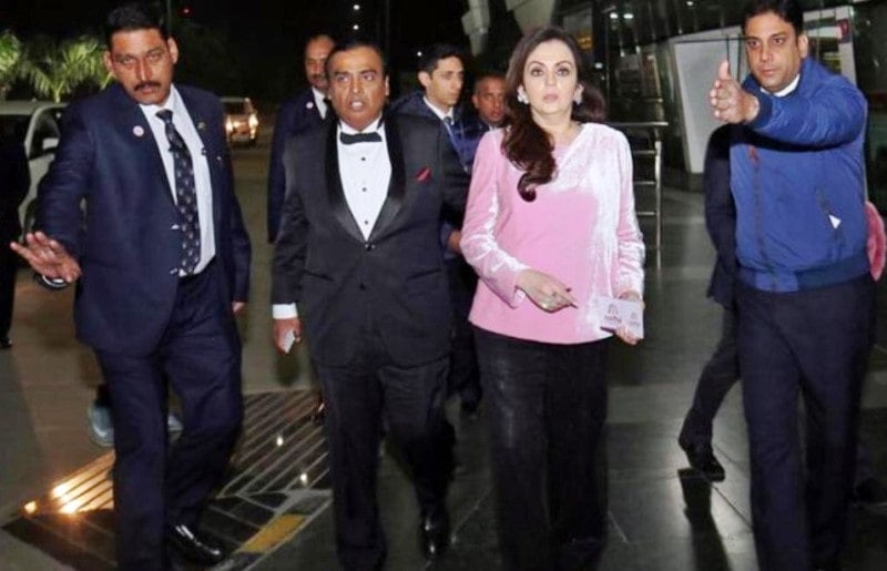 Z+ security officials escorting Mukesh and Nita Ambani at the airport