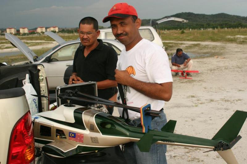 Zaharie Ahmad Shah (right), along with a friend, while experimenting with a remote-controlled aircraft model