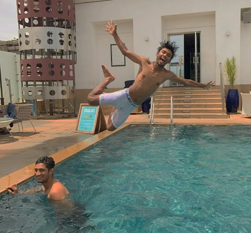 Zeeshan Ansari jumping into the swimming pool