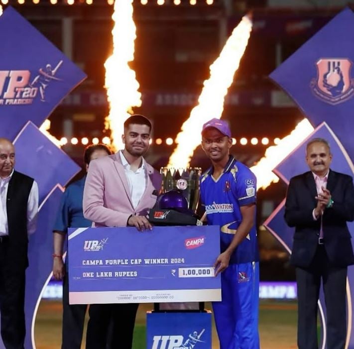 Zeeshan Ansari receiving a purple cap