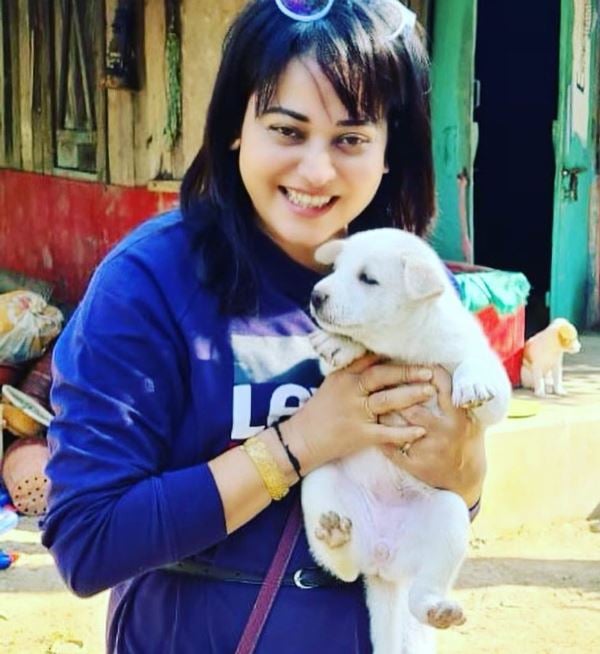 Zerifa Wahid holding a puppy