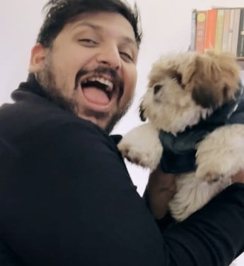 Zorian Cross with his pet dog