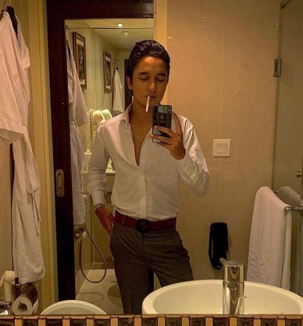 Zuhab Khan smoking a cigarette