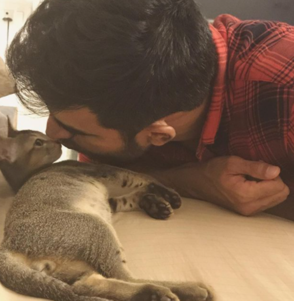 Nishant playing with his pet cat